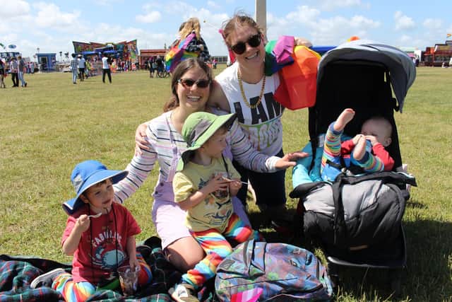 Laura (left) and Lucy Burden-Smith, with their children (from left) Linus, Jude, and St. John. Picture: Emily Turner