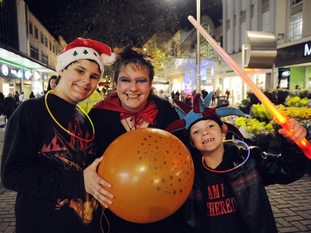 Mark Smith (12), Caroline Smith (41) and Benjamin Smith (seven) celebrating the Christmas lights switch-on in Commercial Road, Portsmouth in 2008.   Festive switch-on of the City Centre Christmas Lights in Commercial Road, outside Debenhams near the Jubilee Fountain and inside the Cascades Shopping Centre.    Picture: Michael Scaddan (084638-0048)