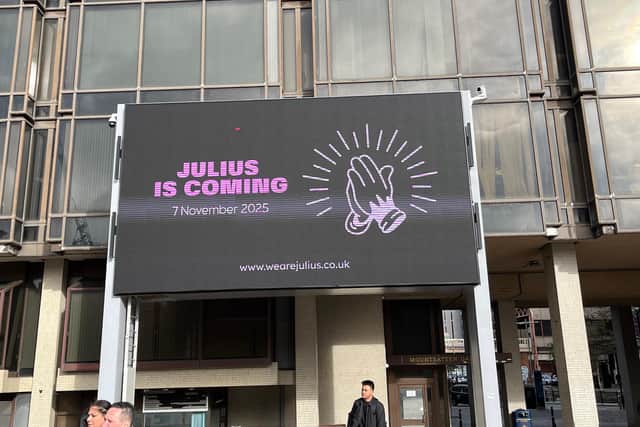 The myterious "Julius is Coming" ad on the big screen at Guildhall Walk.