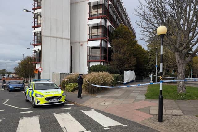 Police at the scene where a dead body was found in Wharf Road