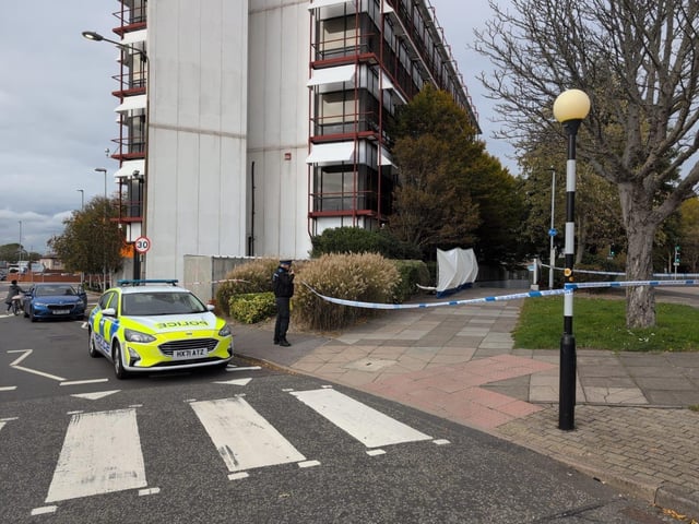 Police at the scene where a dead body was found in Wharf Road