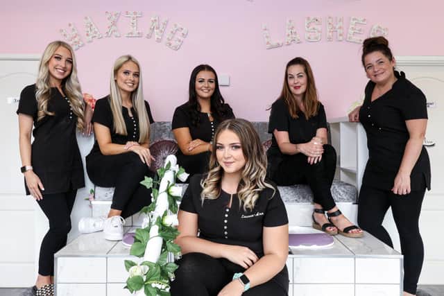 Law graduate Lauren-Ann Lee is happier as a beautician rather than a solicitor. Pictured, front, at her salon, Beauty, in Waterlooville, with from left, Sophie Sadler, Beth Sadler, Morgan Turner, Donna Connis and Diane Simmonds. Picture: Chris Moorhouse (090920-31)