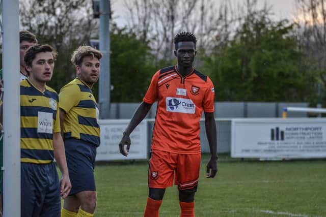 New Portchester signing Lamin Jatta waits for a corner during the 2-2 friendly draw with Paulsgrove. Pic: Daniel Haswell.