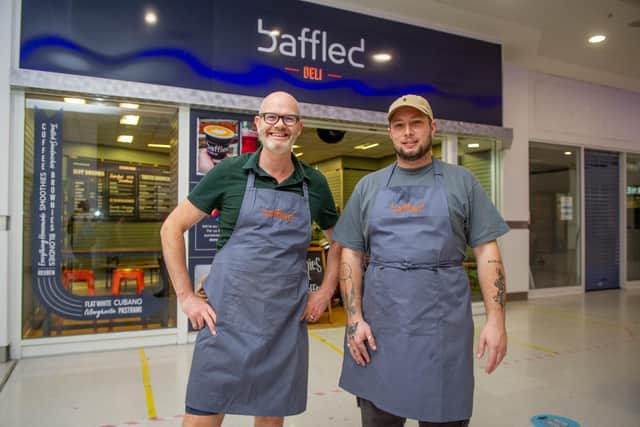Baffled, Cascades Shopping Centre is owned by Fergus McMurray and has been operating from Fawcett Rd for the past 6 years. It has expanded and open a kiosk on the sea front as well as taking on a unit in Cascades
Pictured: Fergus McMurray with staff member, Luke Streeter on Tuesday 22nd September 2021
Picture: Habibur Rahman