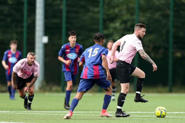 Harvest's Jake Daniels, right, on the ball against US Portsmouth reserves. Picture: Chris Moorhouse