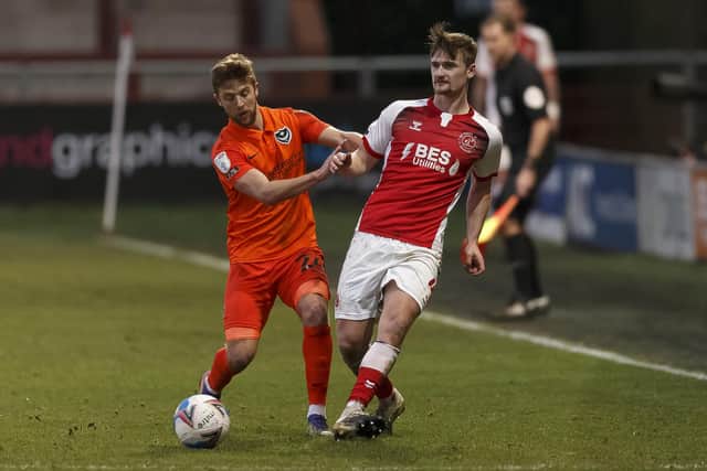 Michael Jacobs jostles with Callum Connolly during Pompey's 1-0 win at Fleetwood on Saturday. Picture: Daniel Chesterton/phcimages.com