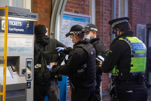 British Transport Police, MOD Police and Hampshire officers were at Fratton railway station seeking to disrupt county line gangs on 3 February 2021.Pictured:  Police searching potential suspects at Fratton station.Picture: Habibur Rahman