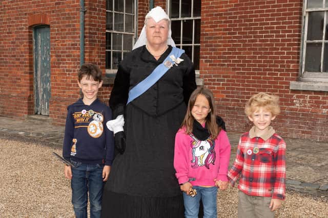 Pictured is: Queen Victoria with Ben Luckins, 7, Fern Shepherd, 6 and Zak Luckins, 4.

Picture: Keith Woodland (110921-136)