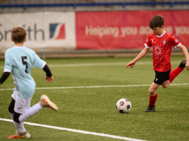 Action from the Portsmouth Youth League Geldard Invitation Cup final between Jubilee 77 U13s and Castle United U13s (light blue and white kit). Picture: Keith Woodland (190321-472)