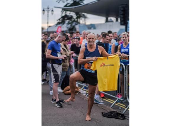 Brave Jason West, 60, ran the entire 10-mile Great South Run course through Portsmouth without any shoes in aid of his chosen charity Médecine Sans Frontiéres, Doctors Without Borders. Photo: Mike Woods
