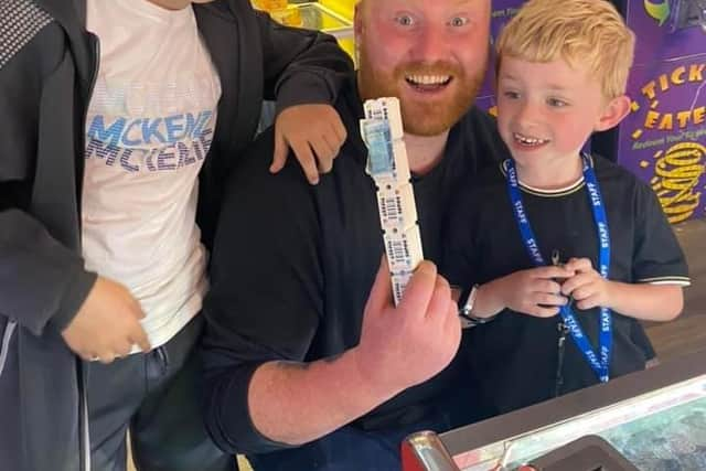 Hayden pictured with his father and brother.