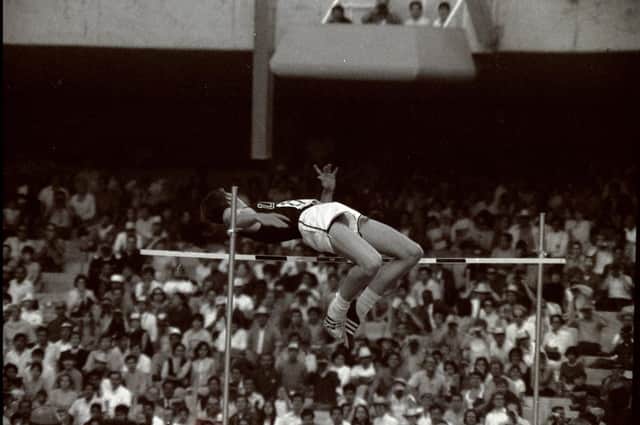 Dick Fosbury of the USA clears the bar in the high jump competiton with his dramatic new jumping style. Credit: Tony Duffy /Allsport