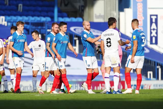 Pompey shake hands after their goalless draw against Shrewsbury on Saturday. Picture: Joe Pepler