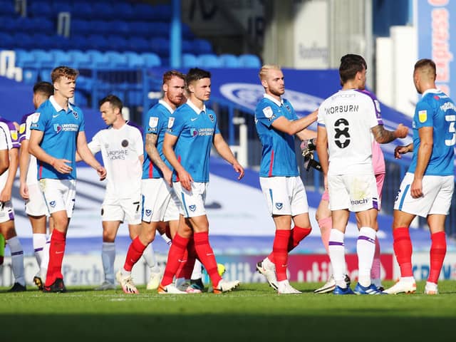 Pompey shake hands after their goalless draw against Shrewsbury on Saturday. Picture: Joe Pepler
