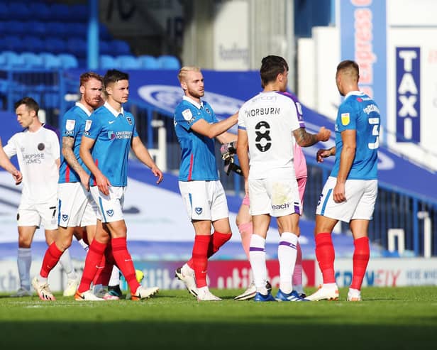 Pompey shake hands after their goalless draw against Shrewsbury on Saturday. Picture: Joe Pepler