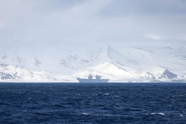 Pictured: HMS Prince of Wales as seen from the flight deck of HMS Richmond as it approached the volcanic Norwegian Island of Jan Mayen. 
Credit: LPhot Bill Spurr