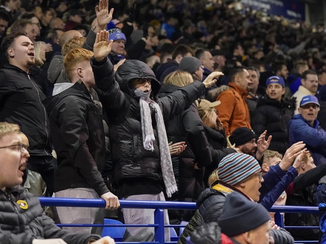 Pompey fans backed their team to a crucial Championship survival win over Cardiff last night.