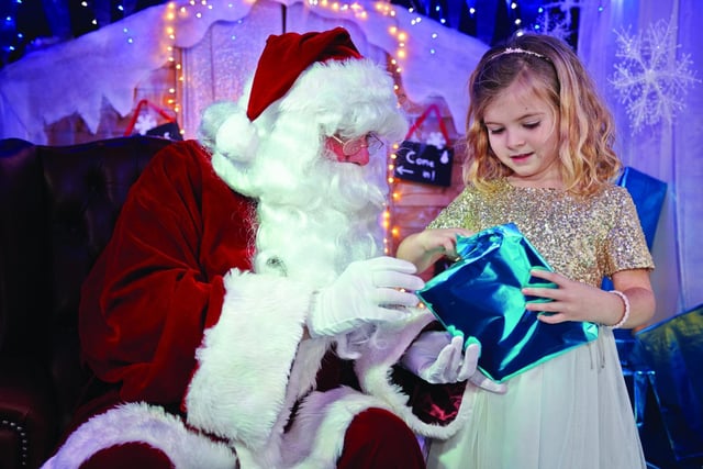 A child meets Santa at Seal Bay in Selsey's grotto