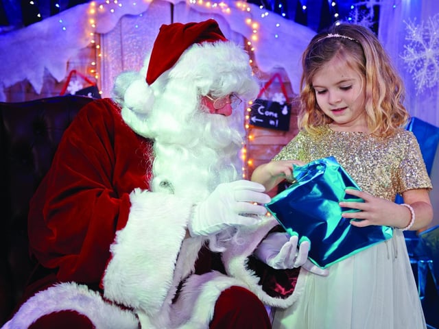 A child meets Santa at Seal Bay in Selsey's grotto