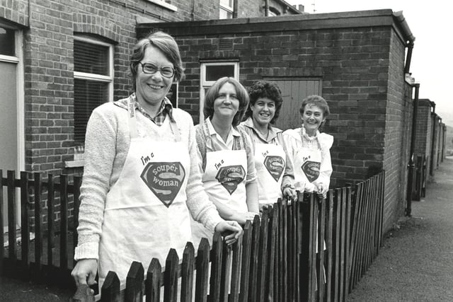 Members of Barnsley Miners Wives Action Group selling aprons made and designed by them to raise money for jailed and sacked miners in the1980s.
