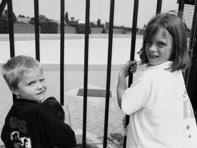 Locked out! Ricky Worsfold and Laura Barley behind the bars of the lido plash pool which was closed because of a pump breakdown in July 1995.