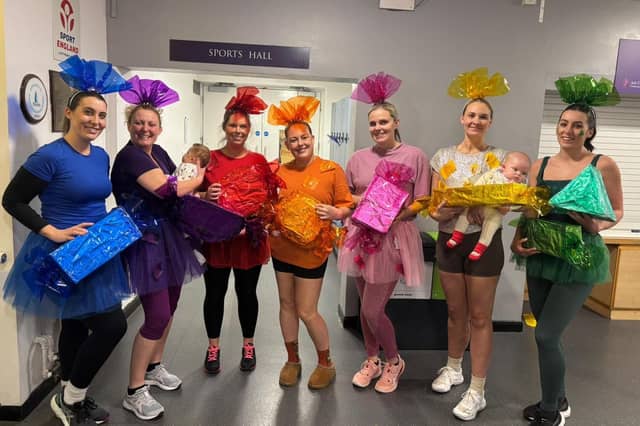 Winners MR Reunite dressed as chocolates from a box of QualityStreet