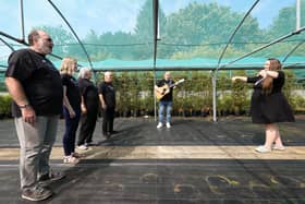 Dielle Hannah, right, performs with the Igloo Choir at Mount Folly Nurseries, Wickham. The choir are having a taster day on August 21st where all are welcomePicture: Chris Moorhouse (jpns 120821-29)