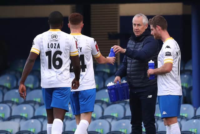 King's Lynn boss Ian Culverhouse speaks to his players during his side's loss to Pompey. Picture: Naomi Baker/Getty Images