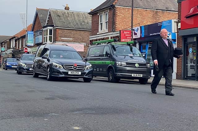 People lined the route in High Street as the funeral cortege of Doreen Colwell passed by. Photo: Tom Cotterill