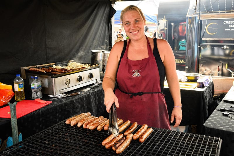 Pictured is: Hayley cooks some more sausages at O'Hagan's sausage stall.
Picture: Keith Woodland (100921-18)