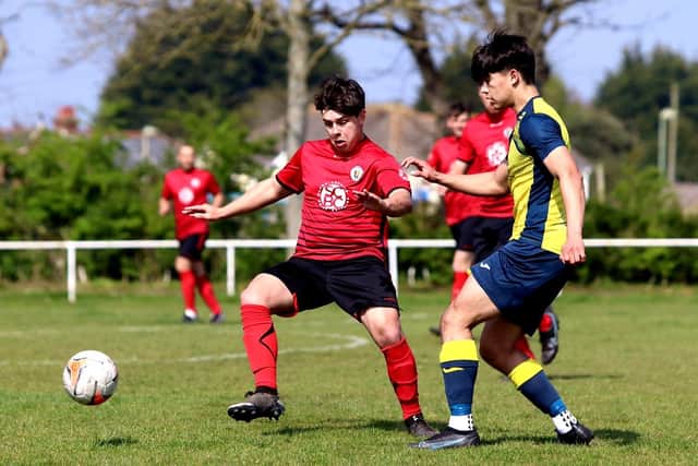 Connor Johnson (Locks, red) and Moneyfields' Alex Pullin. Picture by Tom Phillips