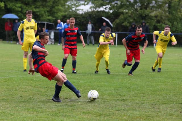 Zac Willett scores a penalty - the first of his Paulsgrove hat-trick against Liphook. Picture: Sam Stephenson