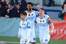 James Roberts celebrates his first goal with Oscar Gobern and Benny Read. Picture by Dave Haines.