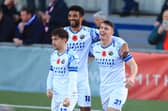 James Roberts celebrates his first goal with Oscar Gobern and Benny Read. Picture by Dave Haines.
