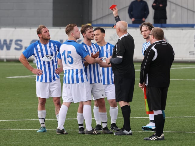 One of four red cards is shown to a Coach & Horses Albion player. Picture by Kevin Shipp
