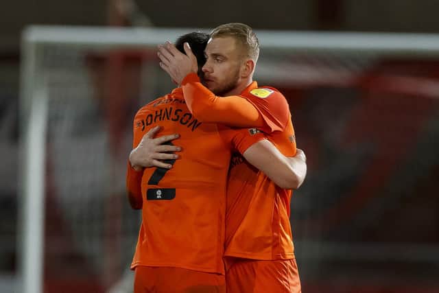 Callum Johnson and Jack Whatmough celebrate Pompey's win at Fleetwood.  Picture: Daniel Chesterton/phcimages.com