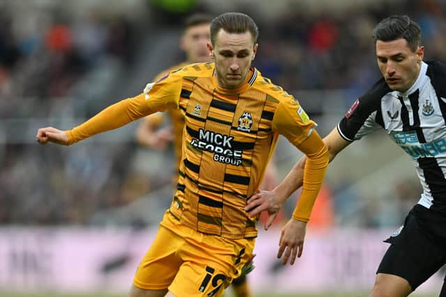 Former Pompey Academy graduate Adam May returned to action for Cambridge United on Tuesday night after nearly a year away from the game because of an ACL injury
