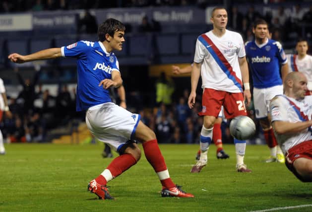 Marlon Pack fires in an attempt on goal on his Pompey debut against Crystal Palace in August 2010. Picture: Mick Young