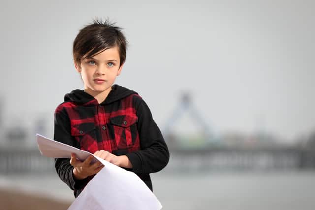 Thomas Roughan, 8, reads his poem called Ruby Red about racism which has been featured on the Black Lives Matter website. Pictured on Southsea beach. He told the photographer that he wants to be a journalist when he grows up
Picture: Chris Moorhouse   (081120-30)