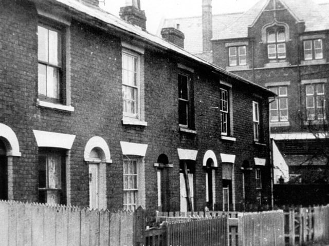 School Lane cottages, Buckland, Portsmouth, with Wellington Place Junior School in the background