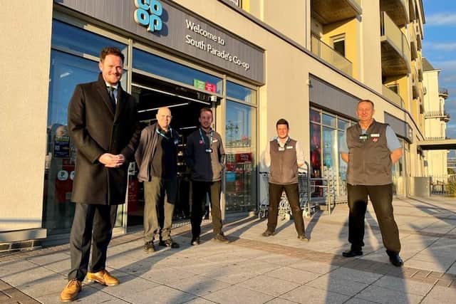 Stephen Morgan with Co-op workers