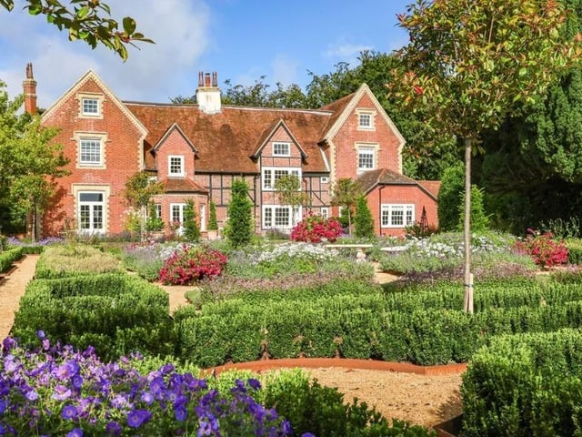 This lovely home has five bedrooms, four bathrooms and five reception rooms.