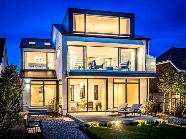 The listing says: "The middle floor living area gives a stunning, elevated panorama of the sea and sky via the huge windows and balcony and includes a smart kitchen, open to the dining area, as well as the snug and a cloak/shower room. The principal bedroom and its bathroom occupy the top floor."