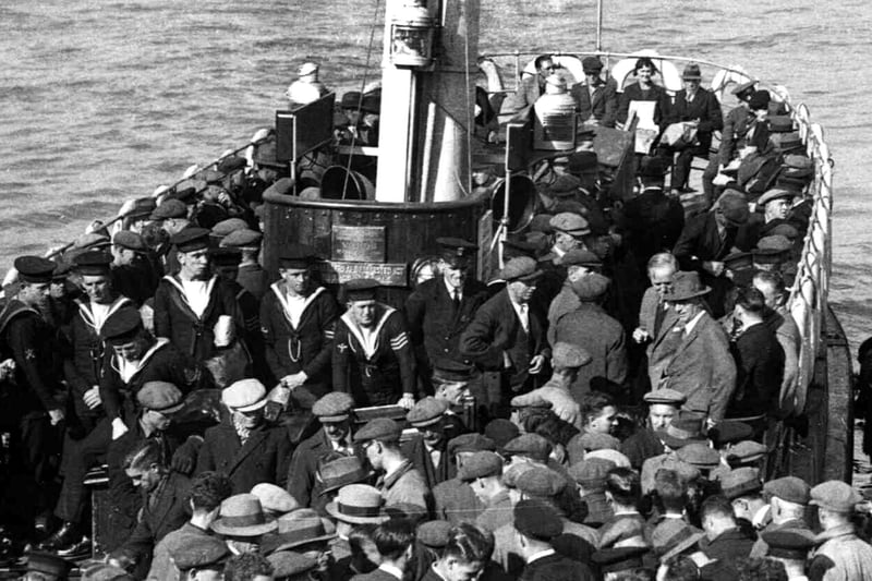 Dockyard workers, sailors and commuters boarding and alighting the Gosport ferry in 1936. Picture: Courtesy Sid Greeman