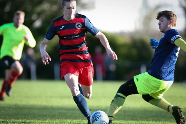 Paulsgrove striker Zak Willett takes the ball past the Bush Hill keeper. Picture: Chris Moorhouse