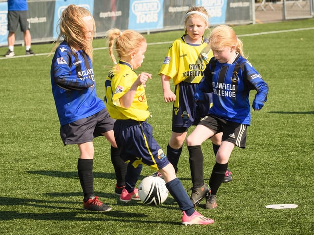Gosport Borough (yellow/blue kit) lock horns with Clanfield. Picture: Keith Woodland (030621-30)