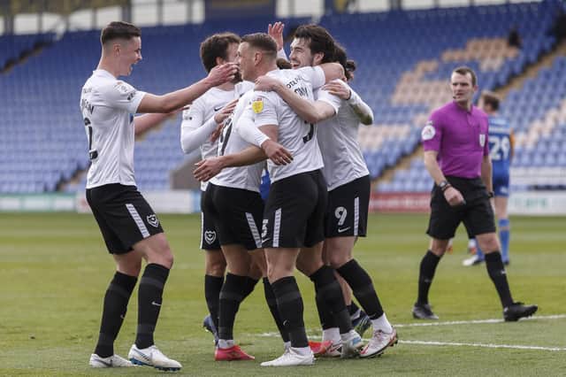 Pompey's players celebrate John Marquis' finish in their 2-1 victory over Shrewsbury. Picture: Daniel Chesterton/phcimages.com