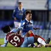 Debutant Charlie Bell, one of a string of Pompey youngsters on display, is tackled by West Ham under-21s' Keenan Appiah-Forson. Picture: Naomi Baker/Getty Images