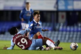 Debutant Charlie Bell, one of a string of Pompey youngsters on display, is tackled by West Ham under-21s' Keenan Appiah-Forson. Picture: Naomi Baker/Getty Images