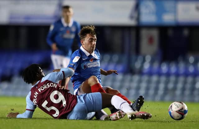 Debutant Charlie Bell, one of a string of Pompey youngsters on display, is tackled by West Ham under-21s' Keenan Appiah-Forson. Picture: Naomi Baker/Getty Images